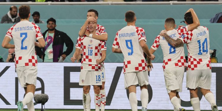 Croatia's forward #18 Mislav Orsic celebrates scoring his team's second goal with his teammates during the Qatar 2022 World Cup third place play-off football match between Croatia and Morocco at Khalifa International Stadium in Doha on December 17, 2022. (Photo by KARIM JAAFAR / AFP)